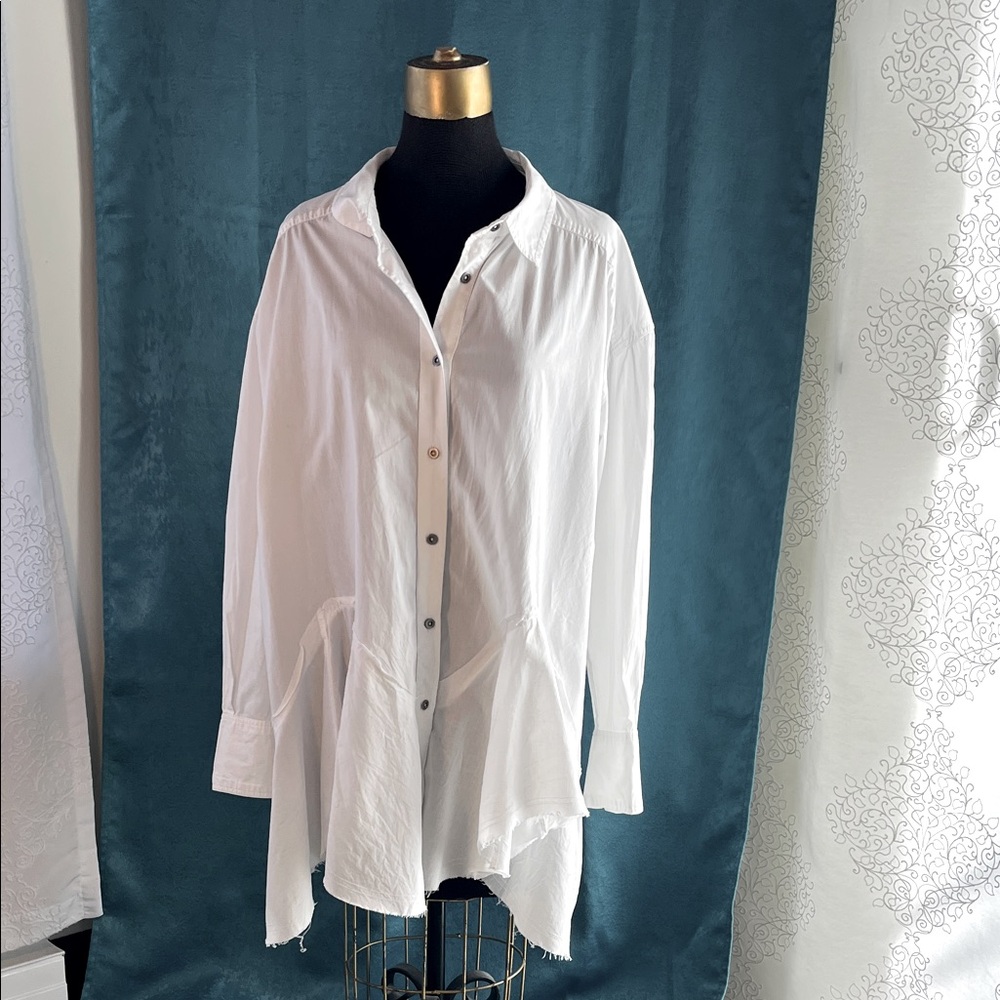 Free People white tunic button down shirt with flounce hem.